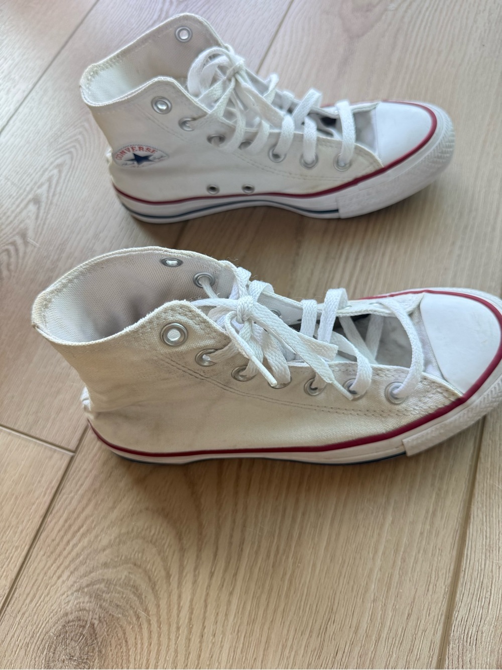 Converse women’s White High-Top Canvas Sneakers with Red Trim